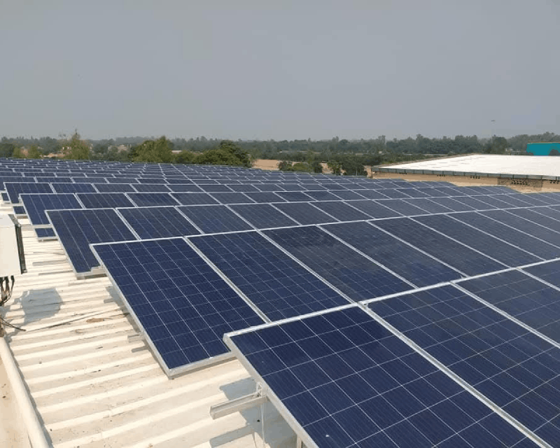 Heavy-duty solar panel array mounting structure on reinforced rooftop